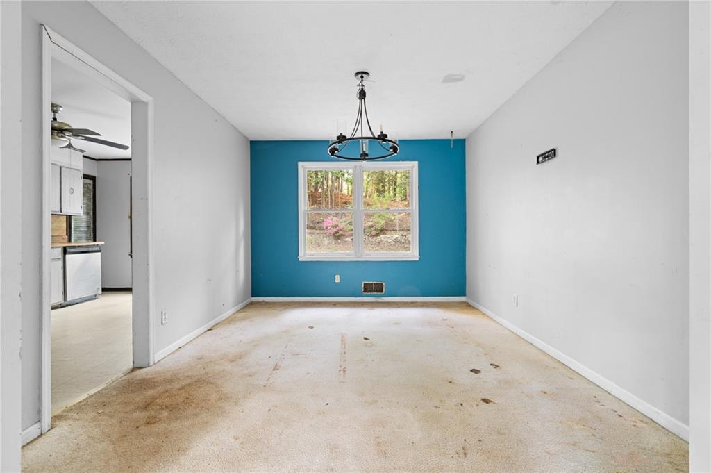 1973 Pinetree Trail Gainesville, GA 30501 - Photo 6 of 26 an empty room with windows and painted walls