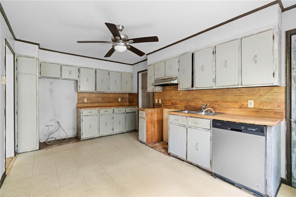 1973 Pinetree Trail Gainesville, GA 30501 - Photo 7 of 26 a kitchen with cabinets window and stainless steel appliances