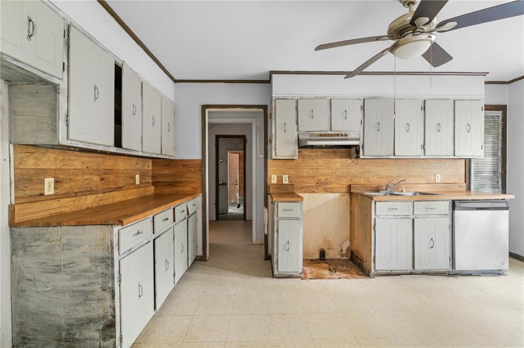 1973 Pinetree Trail Gainesville, GA 30501 - Photo 9 of 26 a kitchen with white cabinets and sink
