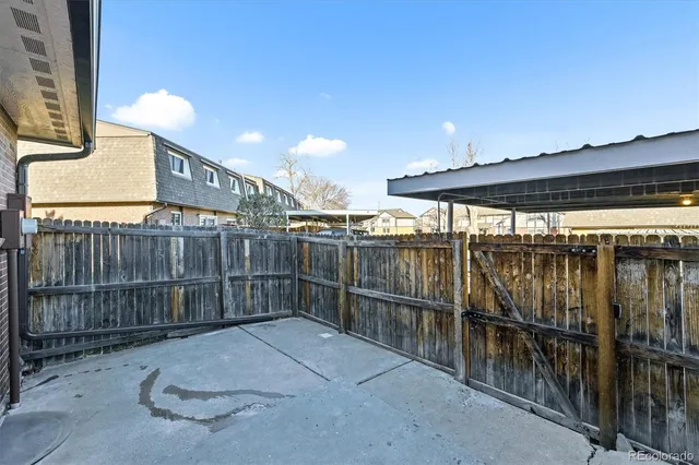 a view of outdoor space with wooden fence
