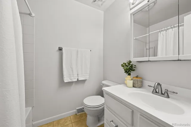 a bathroom with a sink toilet and vanity