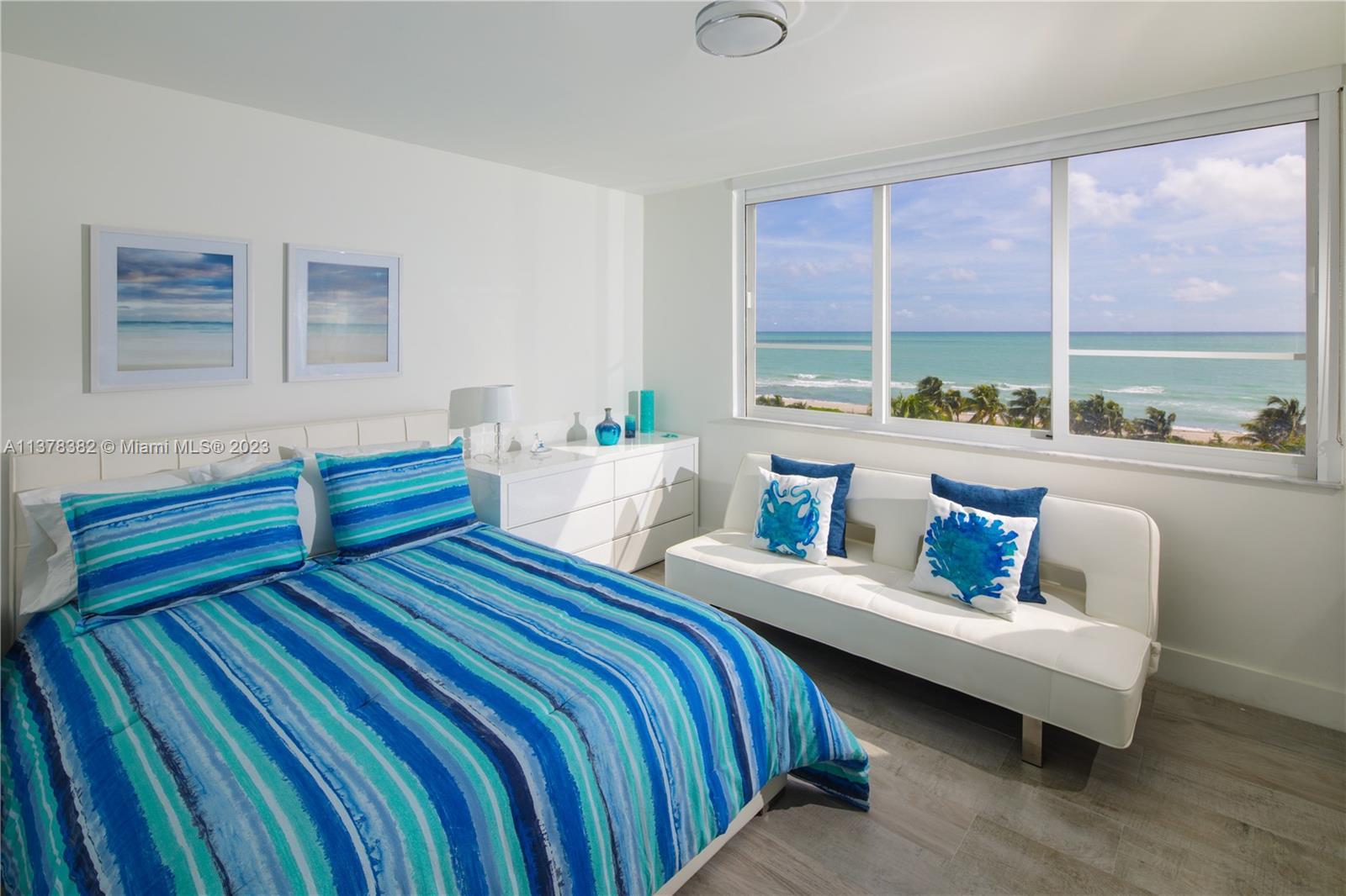 5005 Collins Avenue, Unit 610 Miami Beach, FL 33140 - Photo 18 of 31 a bedroom with furniture and a large window