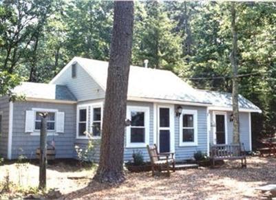 186 Old County Road Truro, MA 02666 - Photo 1 of 1 a front view of a house with a tree