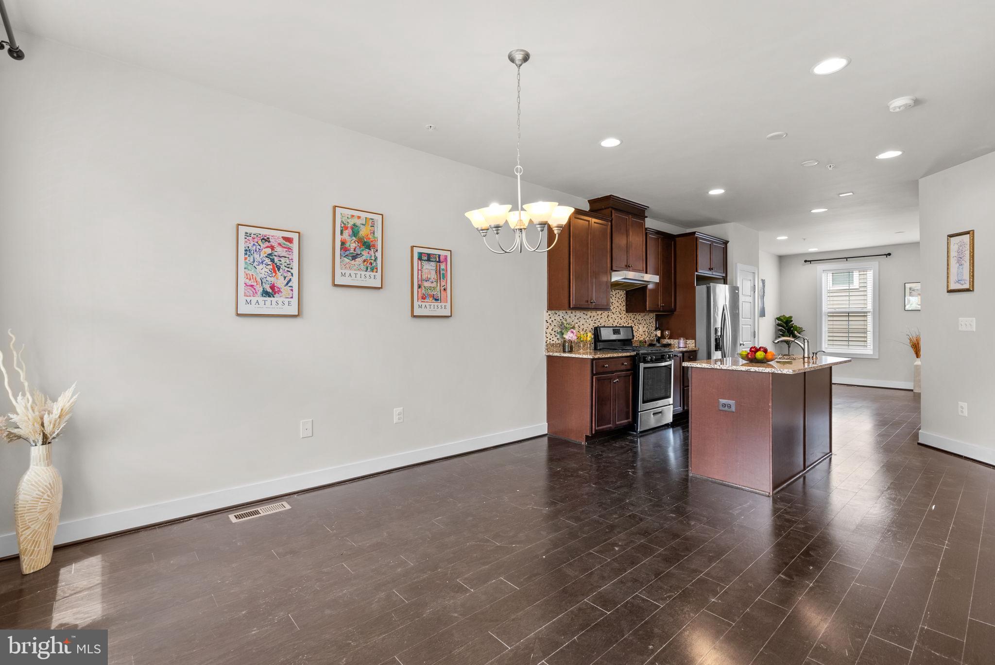 2419 Auden Drive Silver Spring, MD 20906 - Photo 17 of 40 a view of kitchen with kitchen island stainless steel appliances refrigerator stove microwave and cabinets
