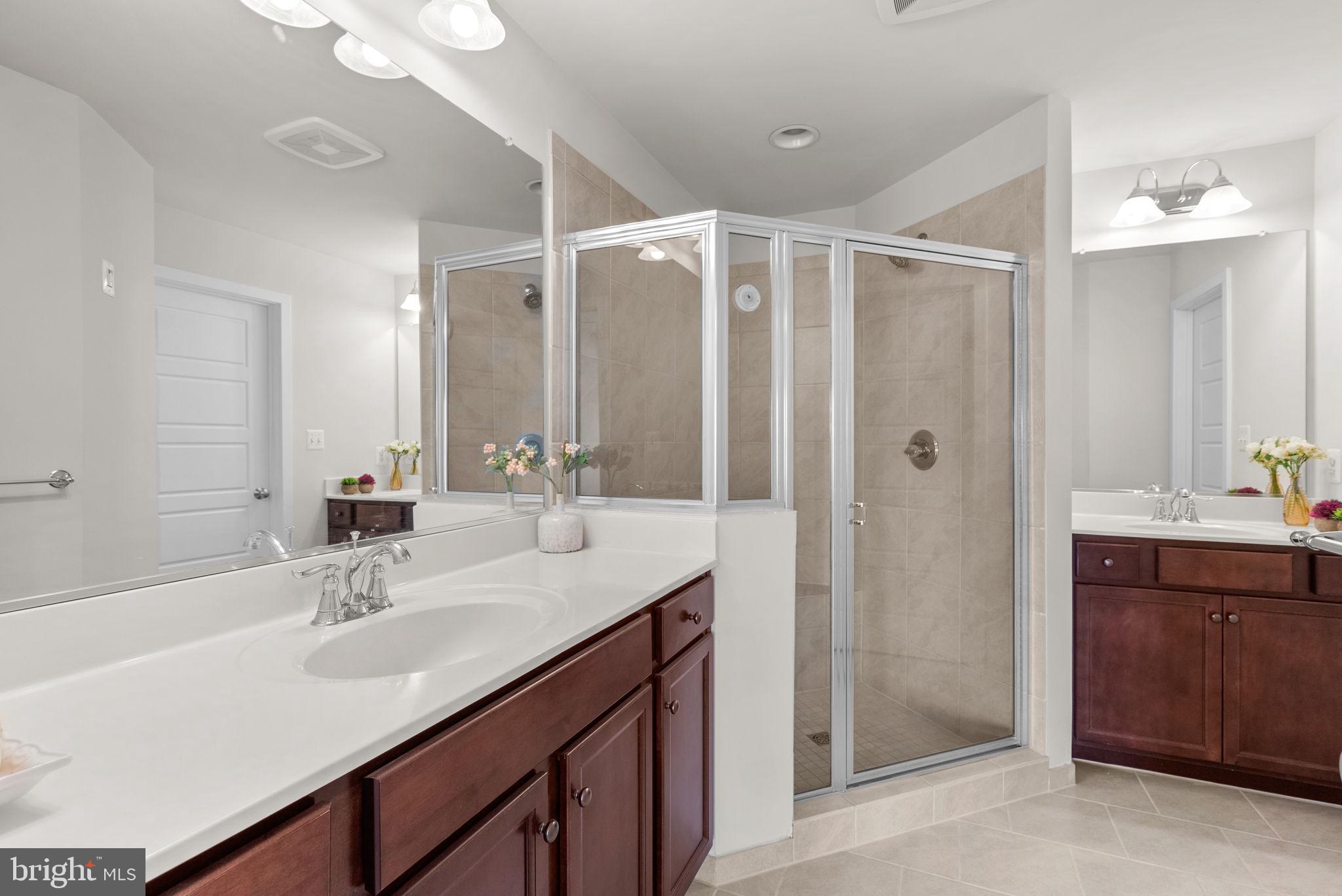 2419 Auden Drive Silver Spring, MD 20906 - Photo 21 of 40 a bathroom with a double vanity sink mirror and double