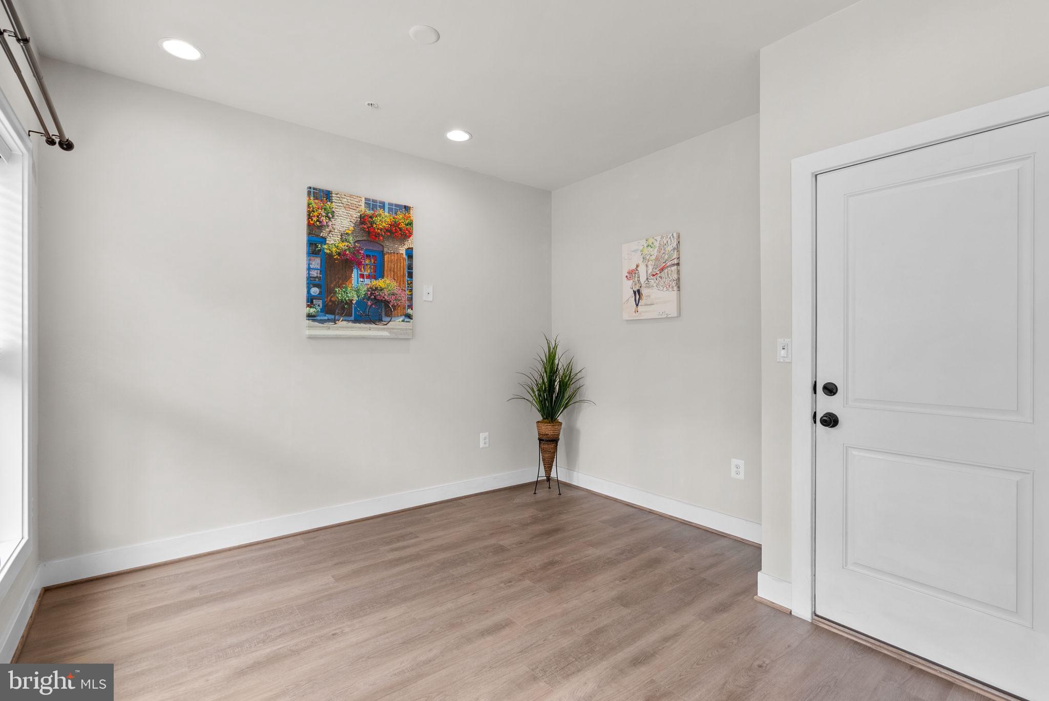 2419 Auden Drive Silver Spring, MD 20906 - Photo 33 of 40 an empty room with wooden floor and window