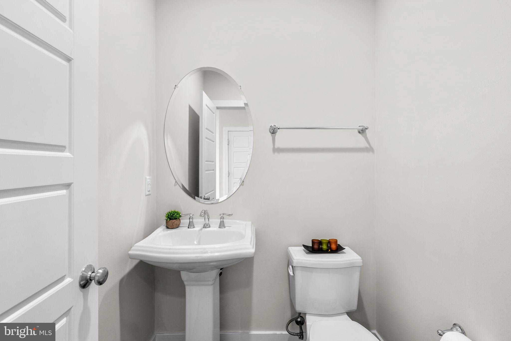 2419 Auden Drive Silver Spring, MD 20906 - Photo 36 of 40 a bathroom with a sink toilet and a mirror