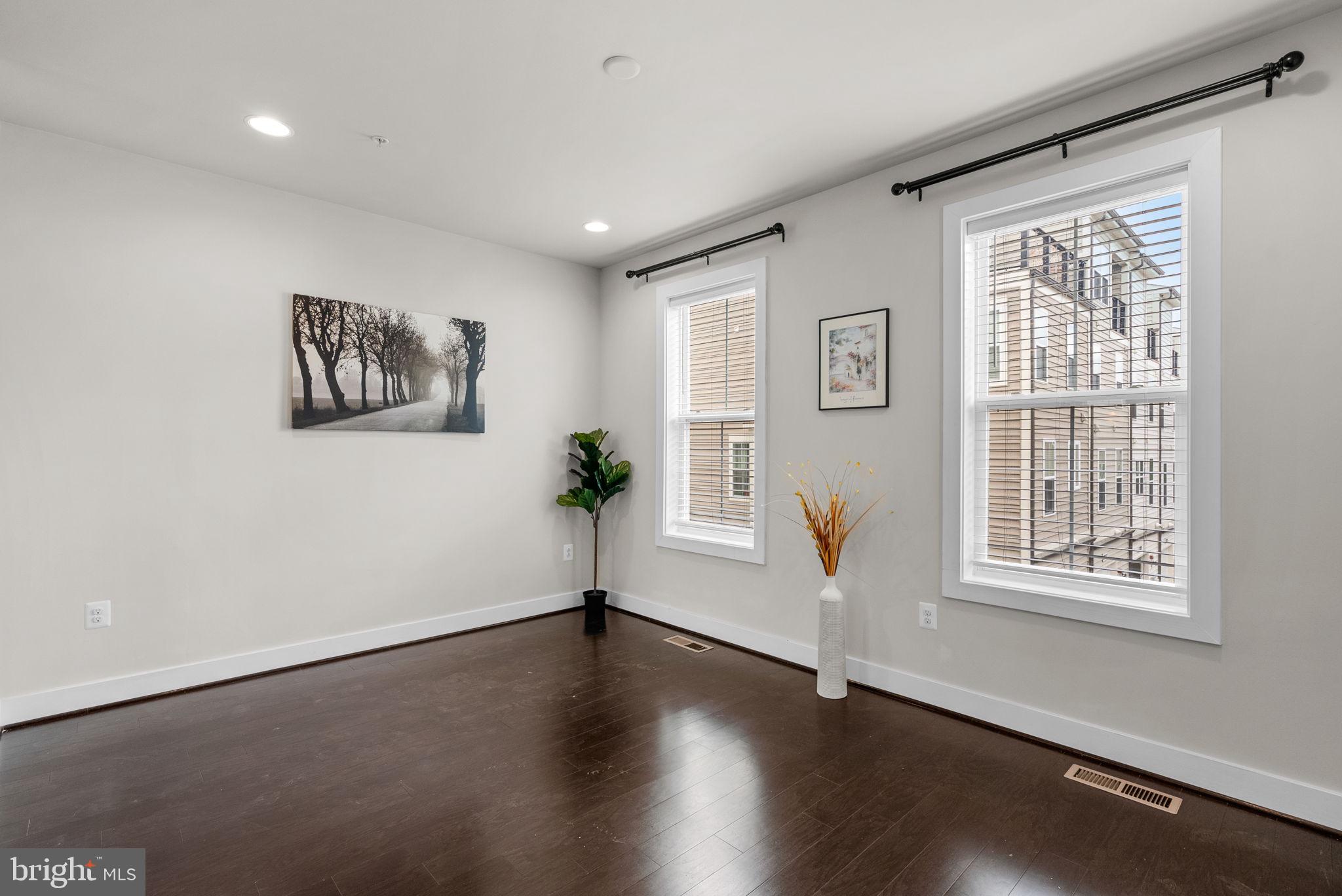 2419 Auden Drive Silver Spring, MD 20906 - Photo 5 of 40 a view of an empty room with wooden floor and a window
