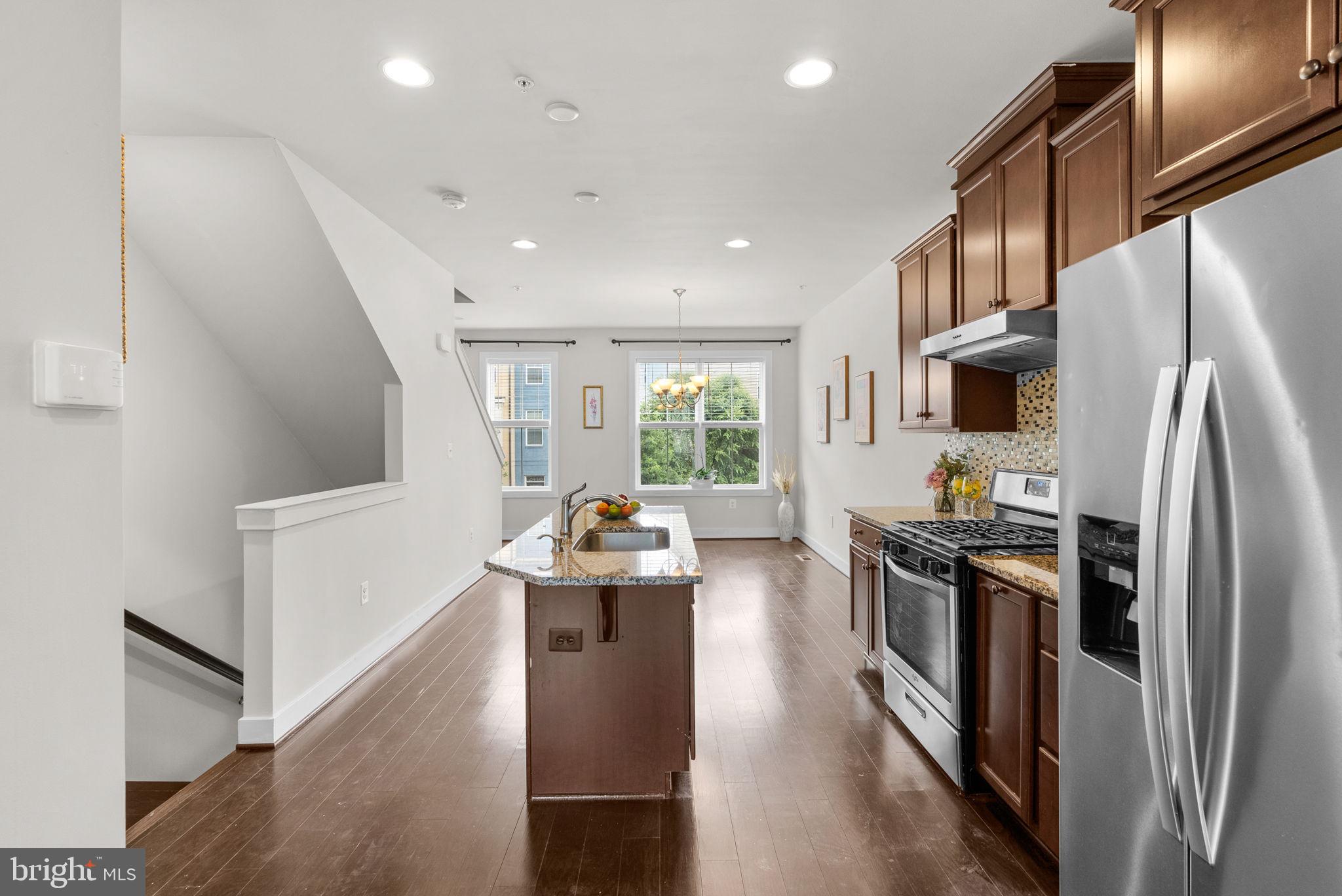 2419 Auden Drive Silver Spring, MD 20906 - Photo 8 of 40 a kitchen with refrigerator and stove