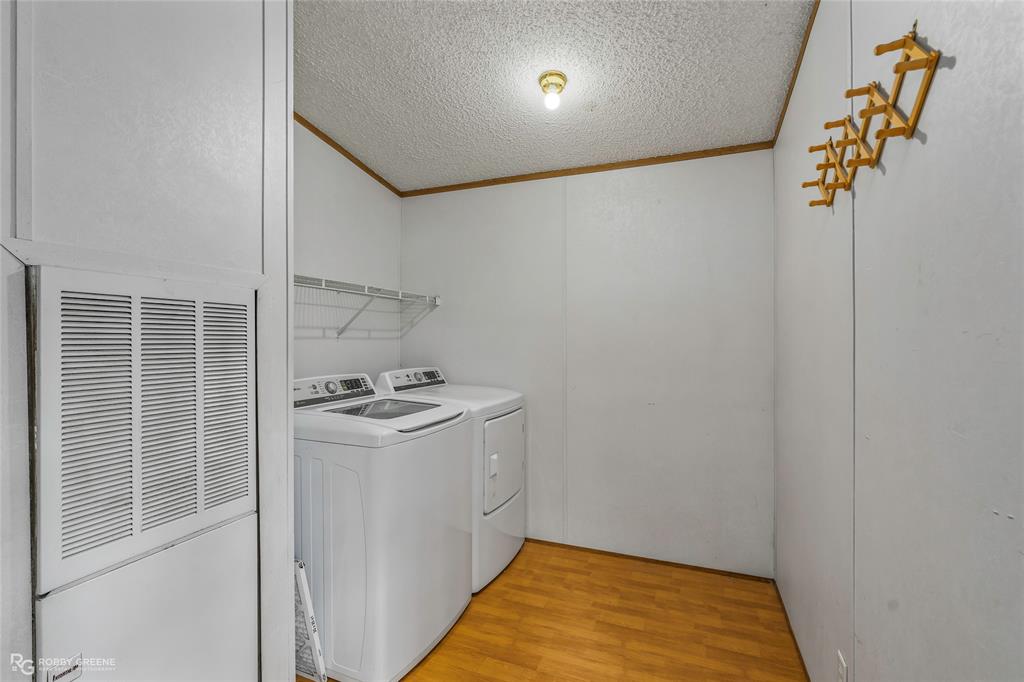 1230 Chipper Lane Keithville, LA 71047 - Photo 27 of 27 a kitchen with a stove and a refrigerator