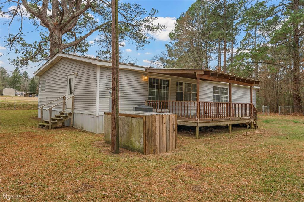 1230 Chipper Lane Keithville, LA 71047 - Photo 4 of 27 a view of a house with a yard and sitting area