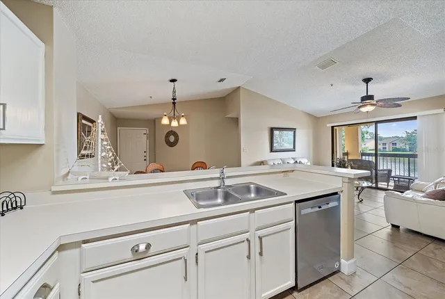 a kitchen with a sink and cabinets
