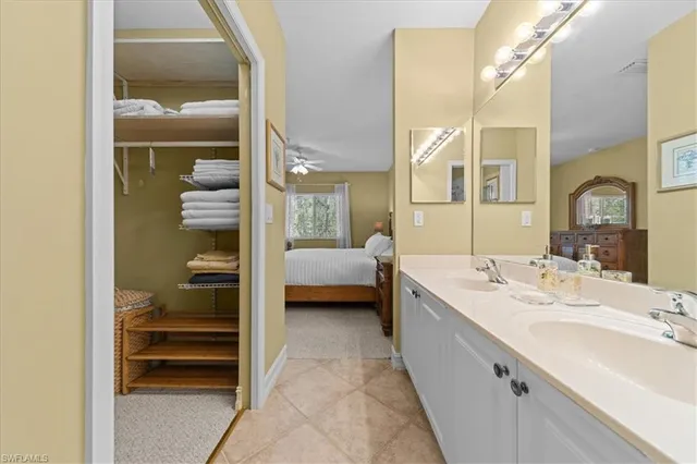 a bed sitting in a room next to a window