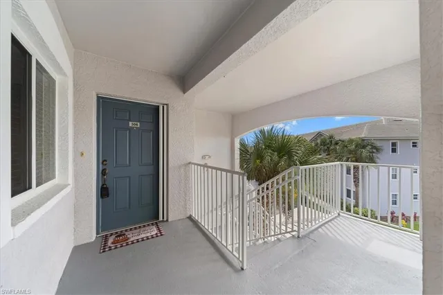 a en suite bathroom with a toilet a sink and a large mirror