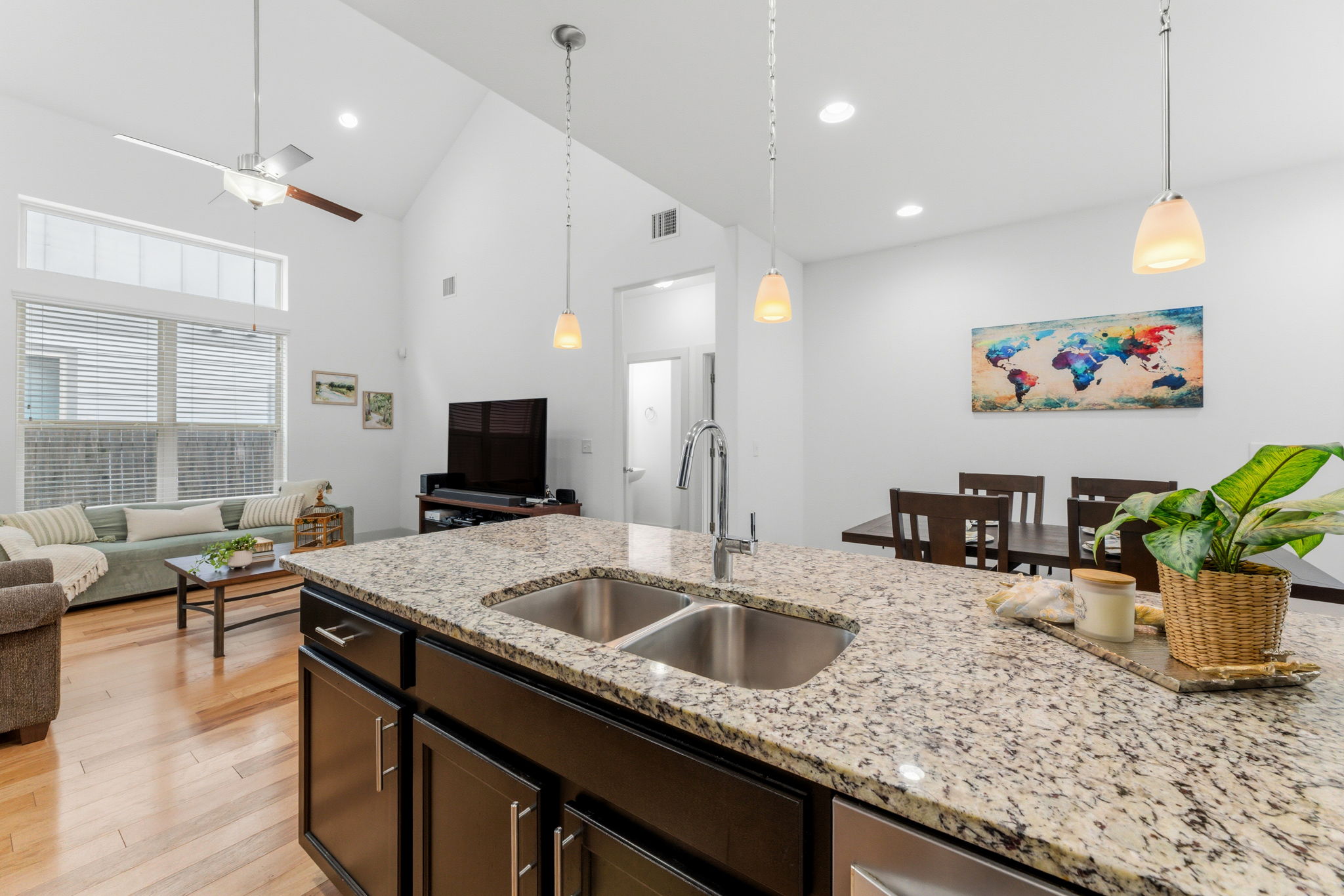1007 Totis Road Austin, TX 78748 - Photo 14 of 37 a kitchen with a sink a counter and chairs in it