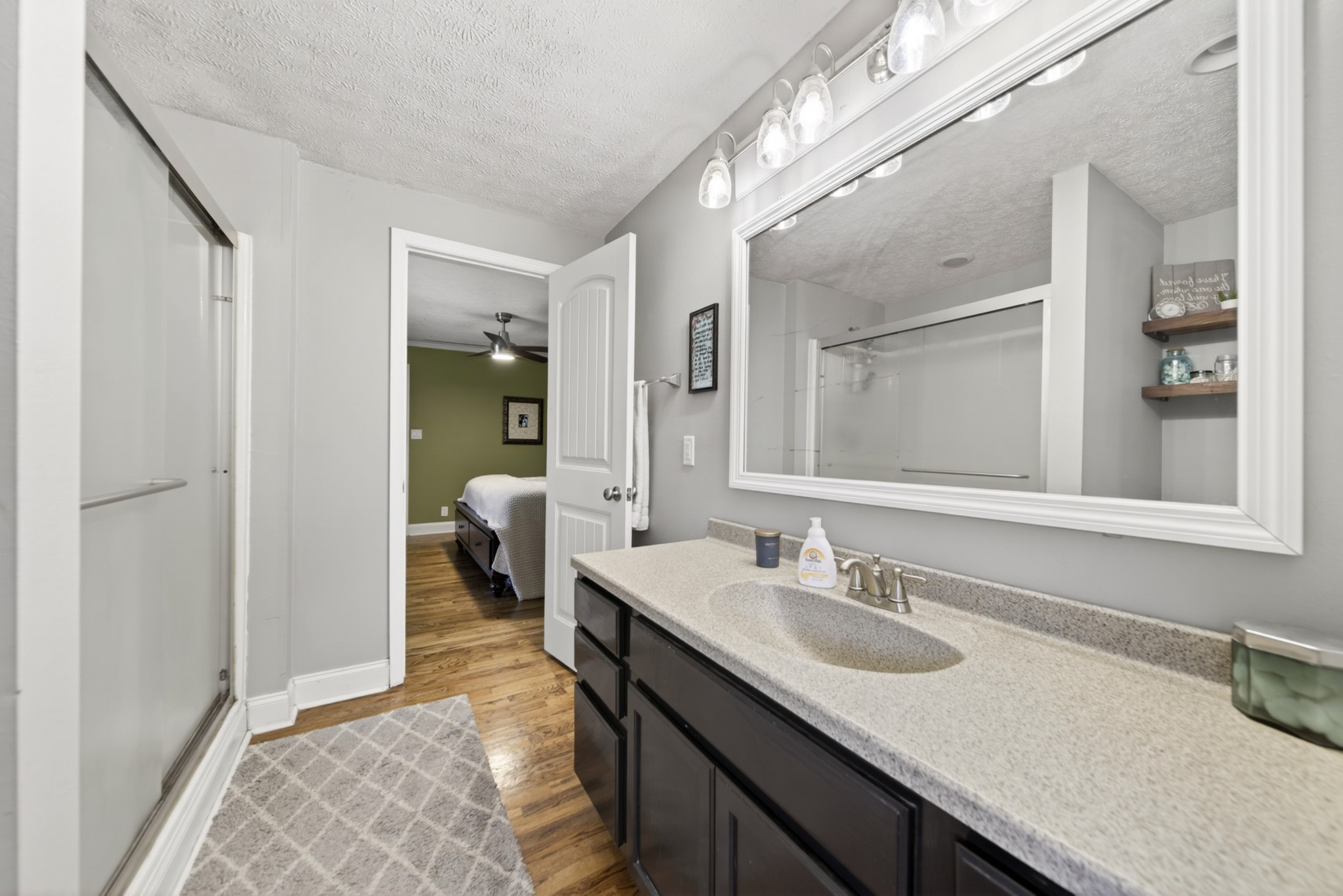 8023 Bethlehem Road Springfield, TN 37172 - Photo 42 of 55 a en suite bathroom with a granite countertop sink and a mirror
