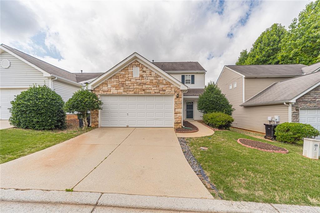 103 Arrowhead Drive Dallas, GA 30132 - Photo 1 of 1 front view of a house with a yard