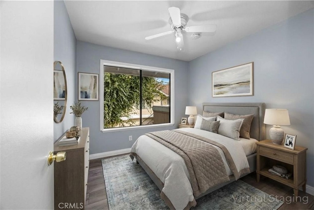 12640 Briarglen Loop, Unit F Stanton, CA 90680 - Photo 17 of 25 a bedroom with a bed and a window