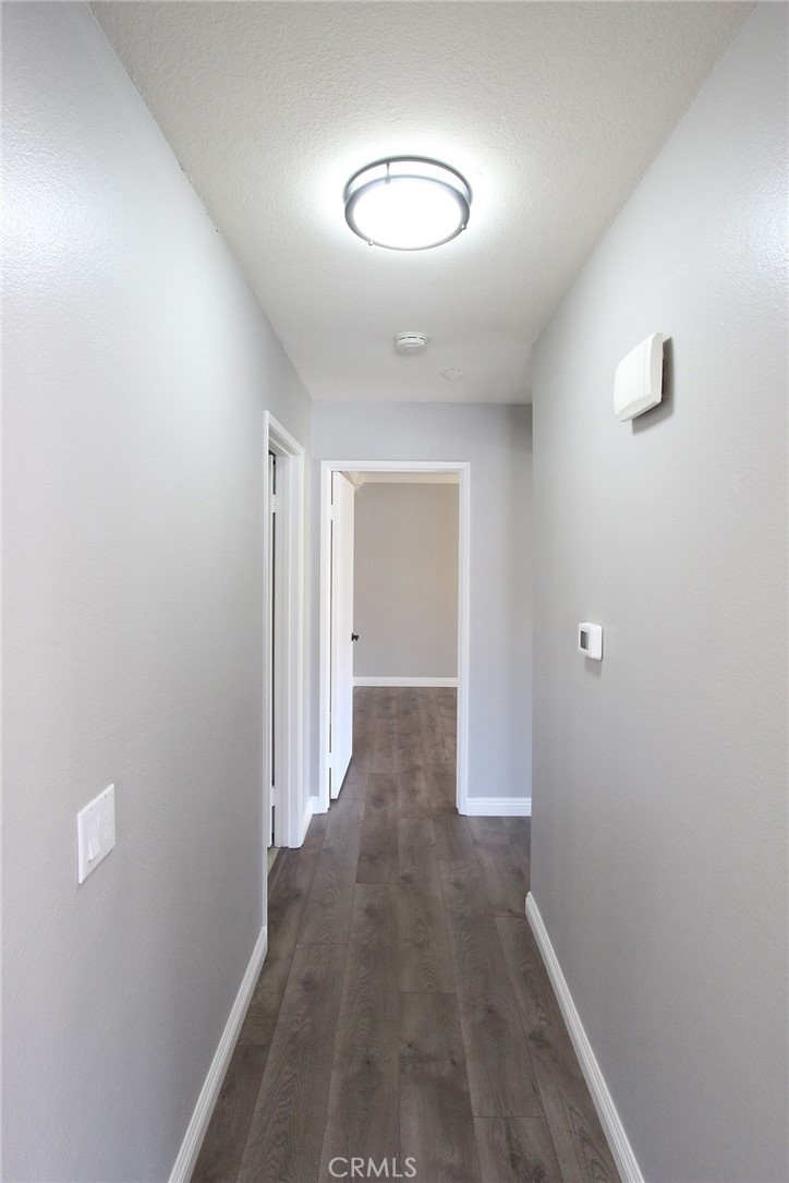 12640 Briarglen Loop, Unit F Stanton, CA 90680 - Photo 19 of 25 a view of a livingroom with wooden floor