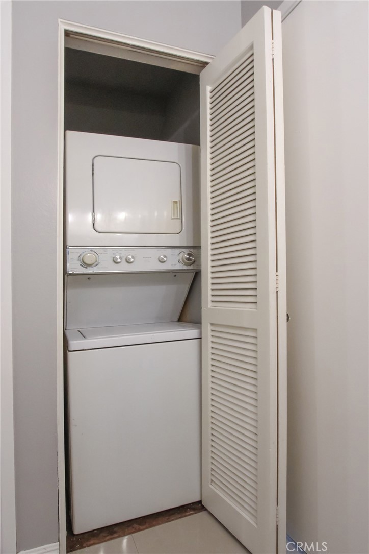 12640 Briarglen Loop, Unit F Stanton, CA 90680 - Photo 22 of 25 a utility room with dryer and washer