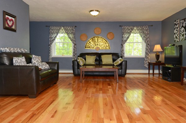 124 Podunk Road Sturbridge, MA 01566 - Photo 4 of 18 a living room with furniture and a flat screen tv