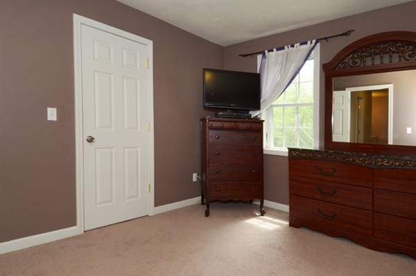 124 Podunk Road Sturbridge, MA 01566 - Photo 10 of 18 a room with furniture and flat screen tv