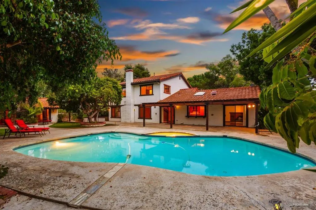 1156 Wild Canary Lane Encinitas, CA 92024 - Photo 1 of 20 a front view of a house with swimming pool having outdoor seating