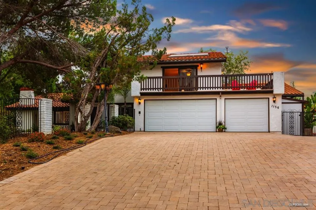 1156 Wild Canary Lane Encinitas, CA 92024 - Photo 2 of 20 a front view of a house with a yard
