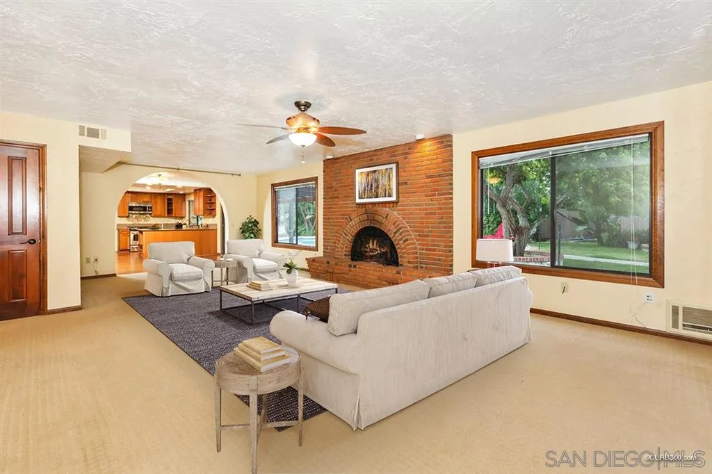 1156 Wild Canary Lane Encinitas, CA 92024 - Photo 10 of 20 a living room with furniture and a fireplace
