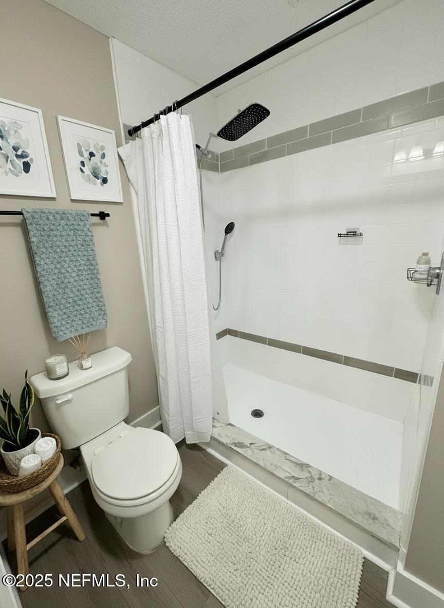 3801 Crown Point Road, Unit 3082 Jacksonville, FL 32257 - Photo 31 of 41 a white toilet sitting next to a bath tub