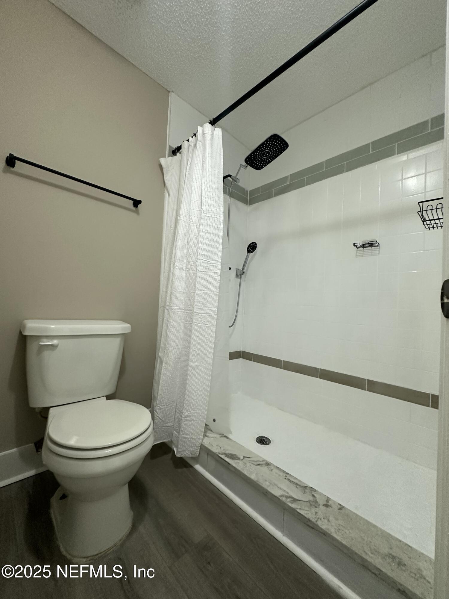 3801 Crown Point Road, Unit 3082 Jacksonville, FL 32257 - Photo 32 of 41 a bathroom with a toilet and a shower