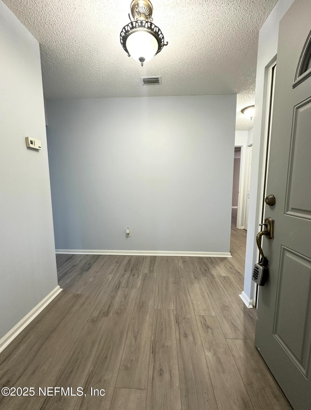 3801 Crown Point Road, Unit 3082 Jacksonville, FL 32257 - Photo 7 of 41 a view of a room with wooden floor