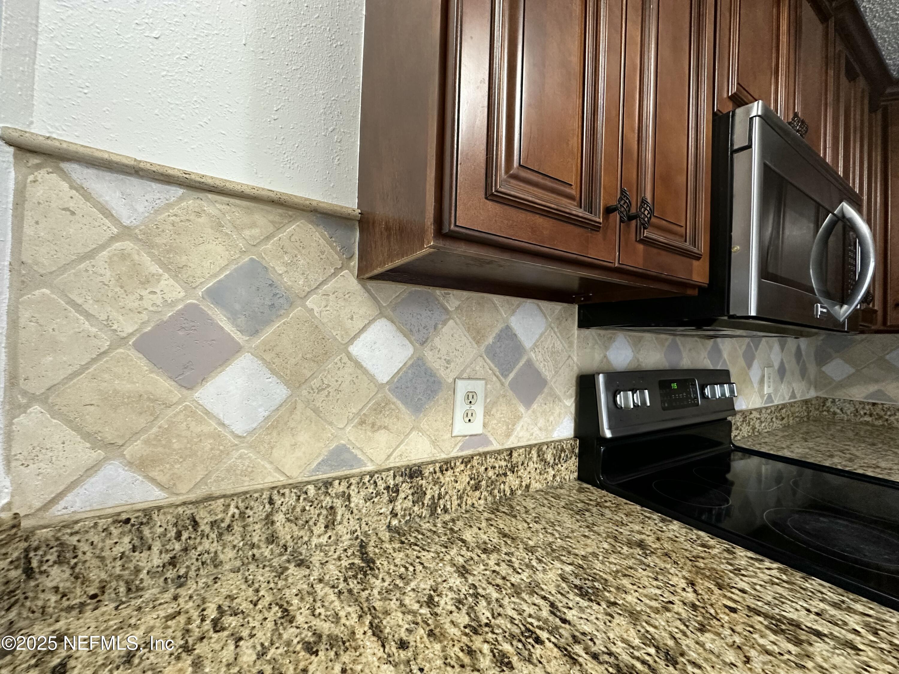 3801 Crown Point Road, Unit 3082 Jacksonville, FL 32257 - Photo 10 of 41 a view of a kitchen with wooden floor and a cabinet