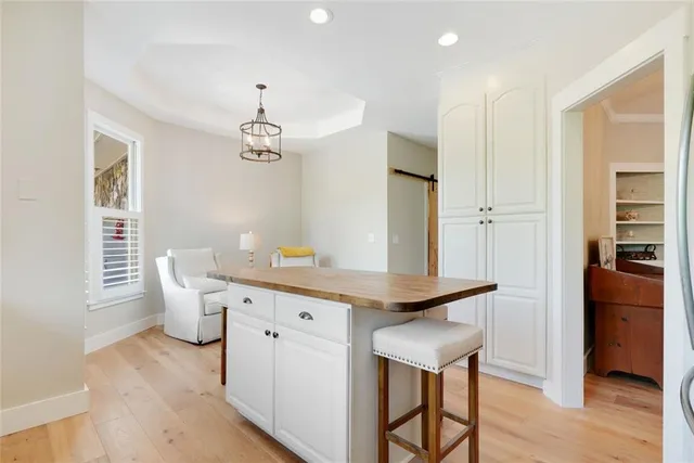 a dining room with furniture and wooden floor