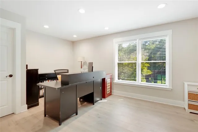 a view of a room with furniture and windows