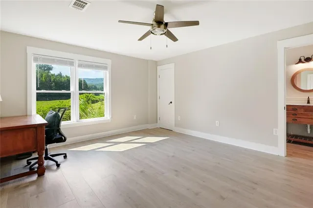 a view of a livingroom with a workspace