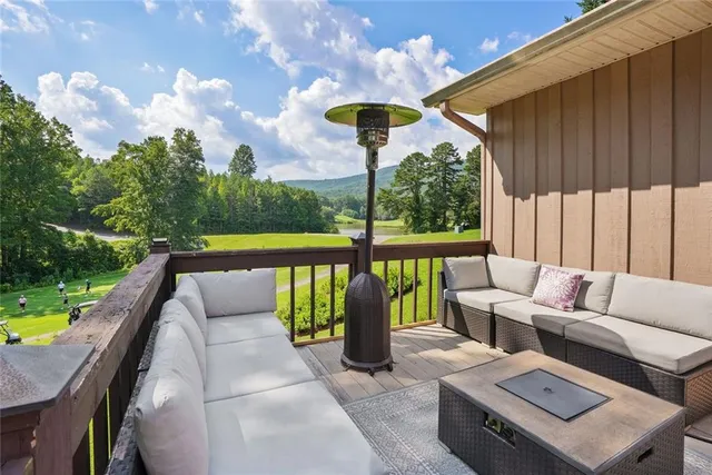 a balcony with furniture and a garden