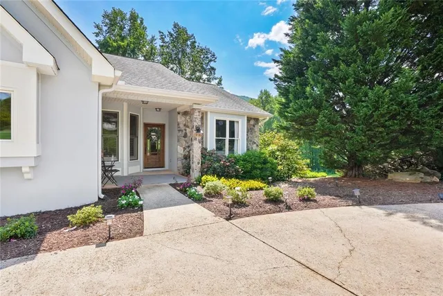 a front view of a house with garden