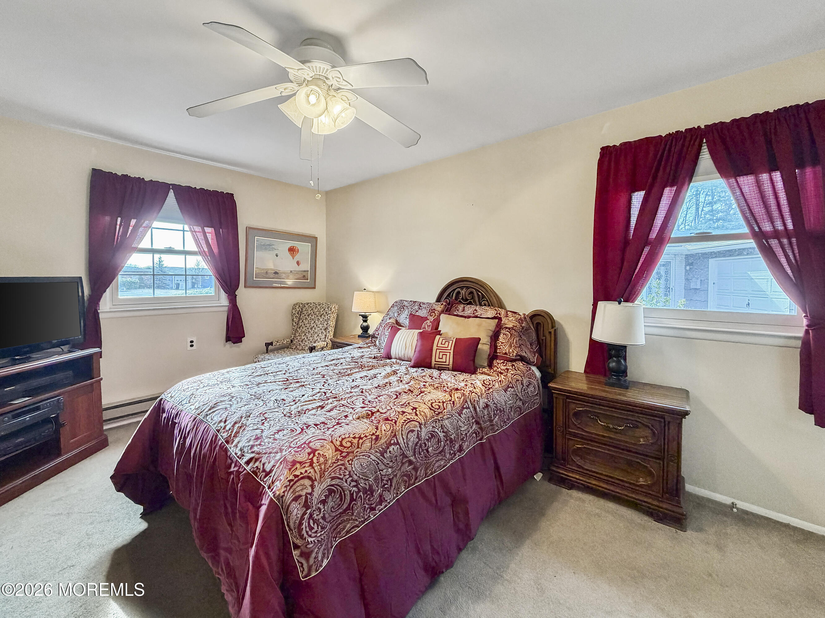 23 Higgins Court Brick, NJ 08724 - Photo 14 of 28 a bedroom with a bed next to a window with outer view