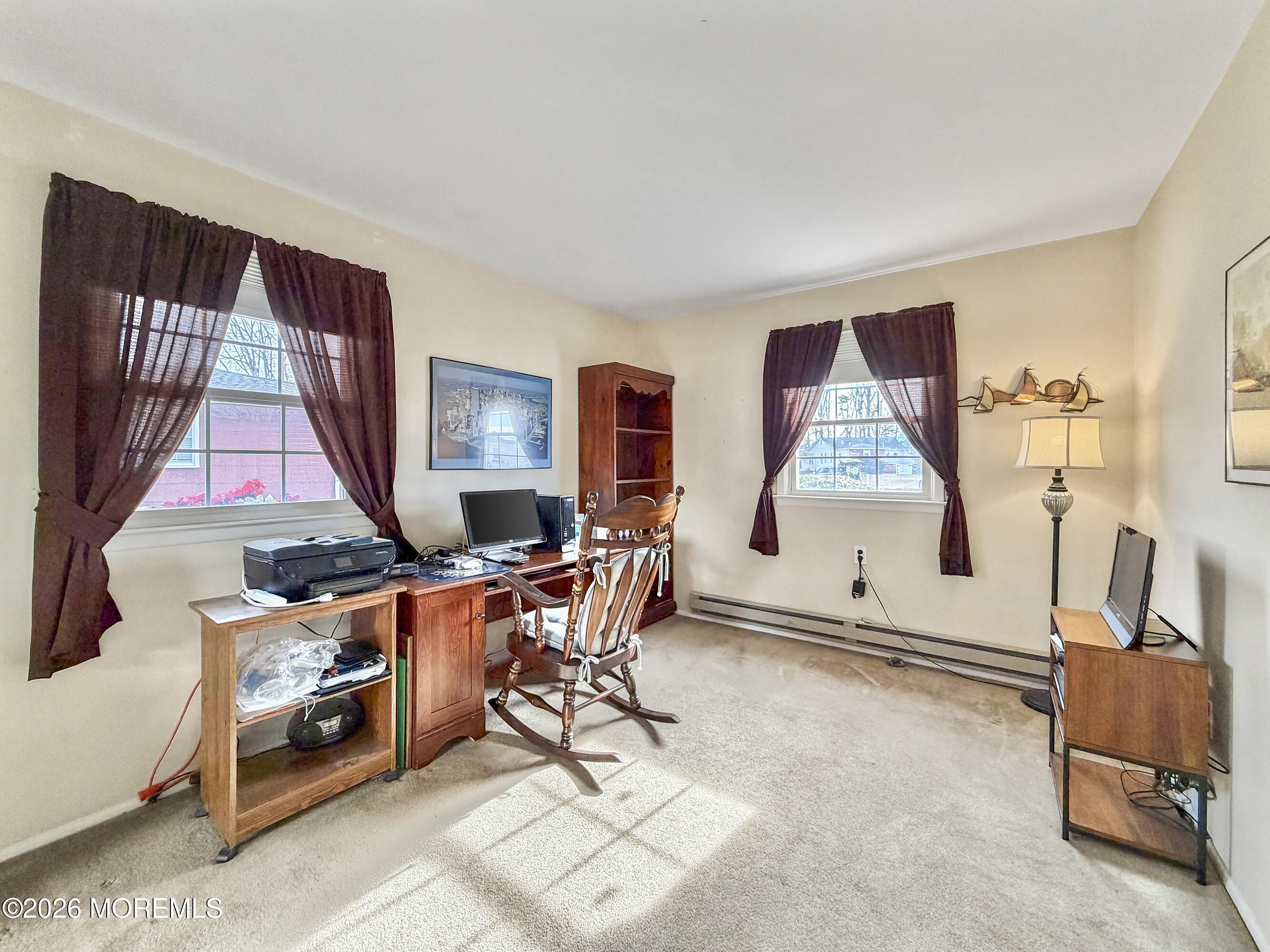 23 Higgins Court Brick, NJ 08724 - Photo 16 of 28 a living room with furniture a window and a flat screen tv