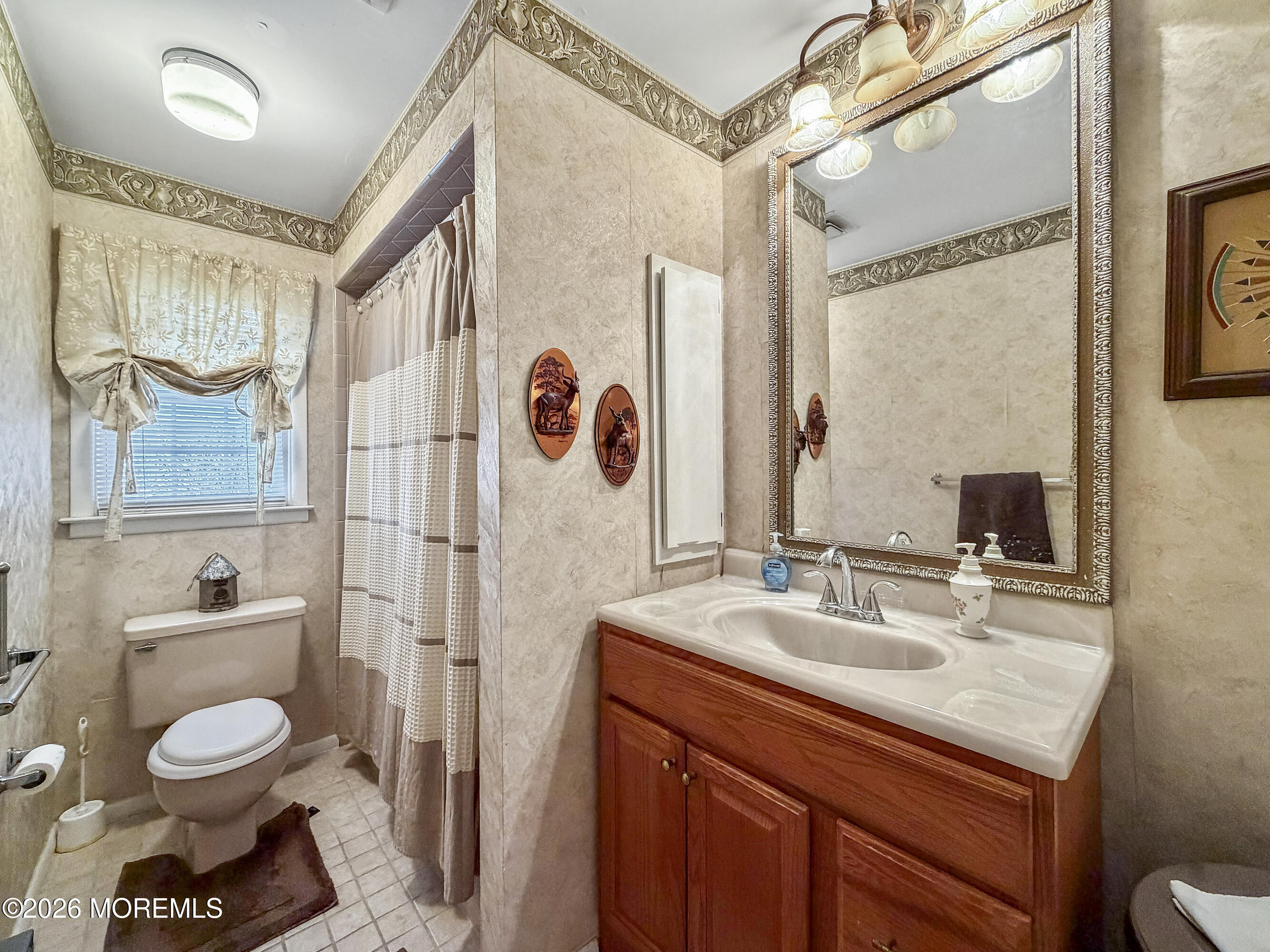 23 Higgins Court Brick, NJ 08724 - Photo 17 of 28 a bathroom with a sink toilet and shower