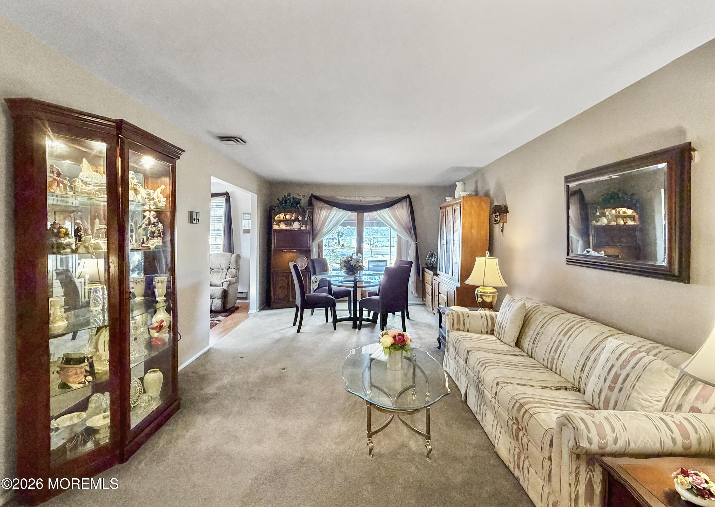 23 Higgins Court Brick, NJ 08724 - Photo 2 of 28 a living room with furniture and a large window