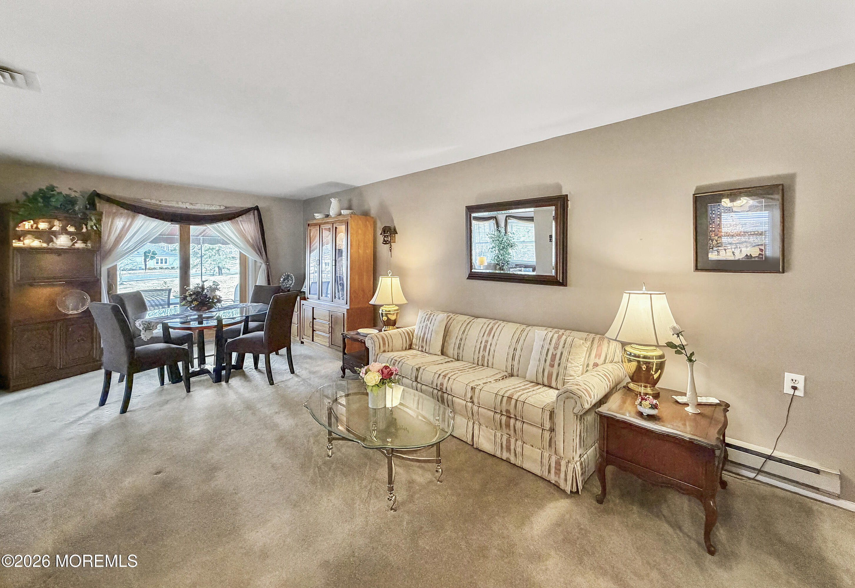 23 Higgins Court Brick, NJ 08724 - Photo 3 of 28 a living room with furniture a table and a large window