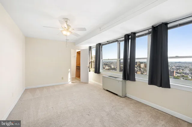 a view of an empty room with a window