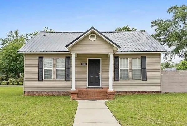 a view of a house with a garden