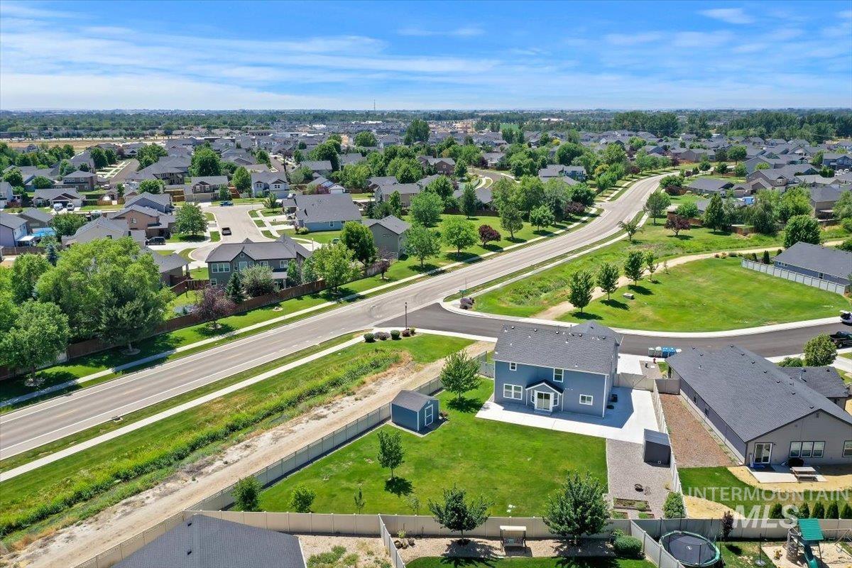 12310 West Hidden Point Drive Star, ID 83669 - Photo 1 of 48 Aerial view Showing open space in front of the house plus the huge back yard and the canal on the side of the house