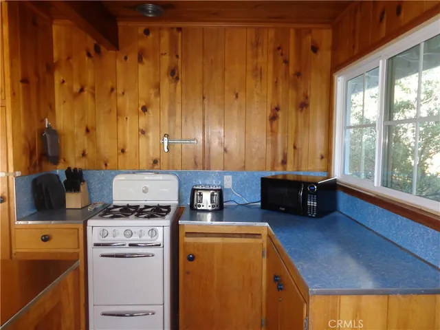 a bed room with a bed and a chair