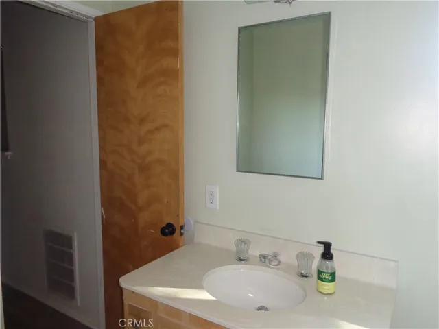 a room with a cabinet and a rug