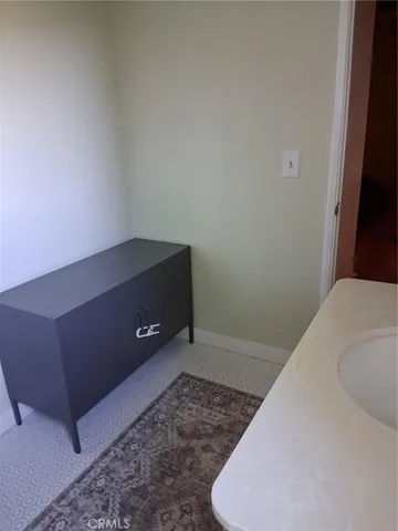 a kitchen with a sink and a refrigerator