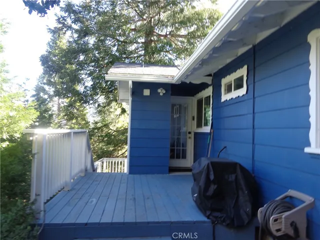 a view of a two chairs in the balcony